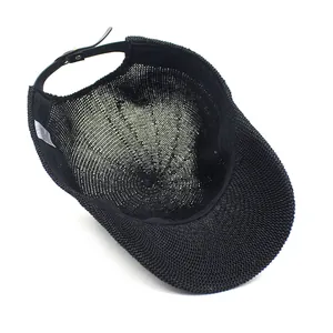 Inside view of black breathable woven straw baseball cap with adjustable leather strap