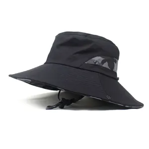 Detail of wide brim sun hat with grey camo patchwork and adjustable chin strap