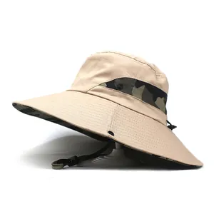 Detail of khaki outdoor sun hat with camouflage mesh vents and adjustable wind strap