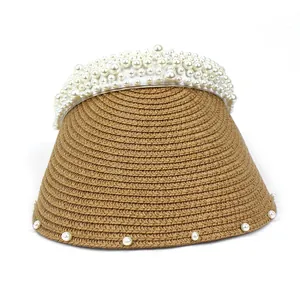 Women's woven straw sun hat with elegant pearl headband and wide brim for summer protection