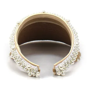 Elegant wide brim straw sun hat for women featuring large pearl embellishments for summer