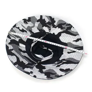 Detail of wide brim sun hat with camouflage pattern and adjustable windproof rope