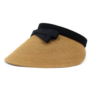 Women's straw sun visor with wide brim and black bow detail for UV protection