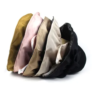 Foldable sun hat detail showing side-stacked colors with zipper rim and bow design