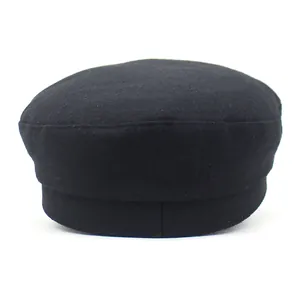Detailed view of high-quality black wool felt fabric on a minimalist flat top military cap