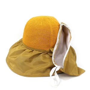 Bright yellow sun hat with wide brim, breathable mesh crown and portable storage pocket
