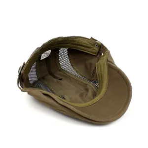 Detail view of khaki cap featuring breathable mesh panels and internal cotton size label