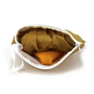 Portable mustard yellow storage pouch with smooth zipper and handle for sun hat