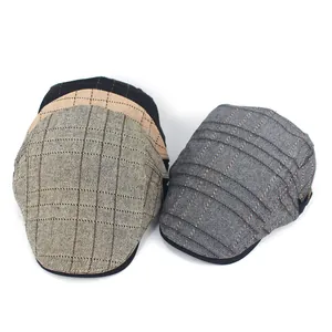 Detailed close-up showing the vintage striped patterns and varied colors of newsboy caps