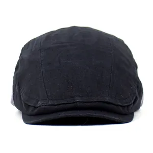 Detailed top view of stitched black cotton flat cap with fixed brim and plain design