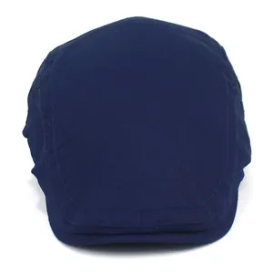 Detailed front view of navy blue cotton flat cap showing neat stitching and twill texture