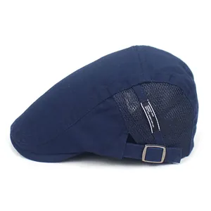 Detail of navy cotton flat cap showing breathable mesh panels and adjustable metal buckle