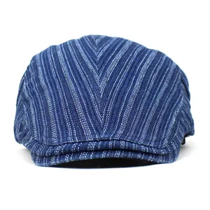 Close-up of blue and white striped cotton denim ivy cap showing fabric texture and V-pattern