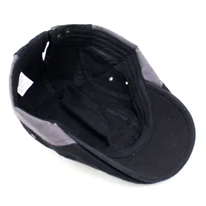 Inside view of men's cotton patchwork beret hat showing 100% cotton label and stitching