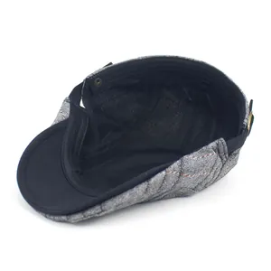 Men's dark grey striped beret with diamond quilting and black brim, top view
