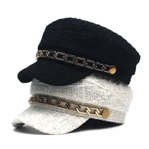 Classic tweed sailor hats in black and white with gold chain decorative accents