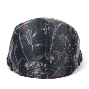 Close-up of vintage washed denim beret featuring floral print and side metal buckle