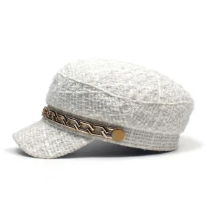 Elegant white tweed newsboy hat with gold chain detail on a clean white background