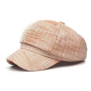 Stylish orange and white tweed octagonal beret hat with a classic textured finish