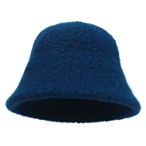 Detailed texture of dark blue sherpa fleece fabric on a winter bucket hat for women