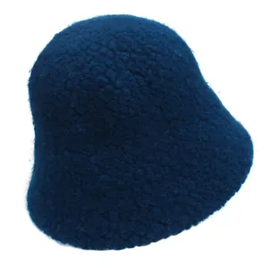 Macro detail of dark blue lamb wool bucket hat showing soft fuzzy texture and fabric