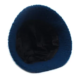 Deep blue plush lamb wool bucket hat with warm lining for winter fashion style