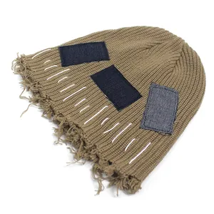 Vintage khaki knit beanie with denim patches and distressed fringe for hip hop style