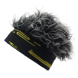 Hip hop beanie with grey synthetic hair and gold geometric knit patterns on black fabric