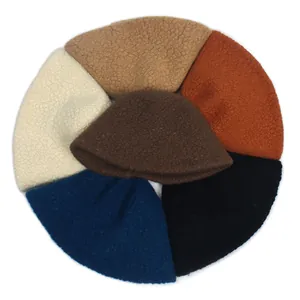 Close-up of fluffy sherpa bucket hats in multiple solid colors for winter season