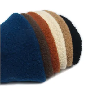 Detailed macro view showing plush faux shearling texture in multiple autumn-winter colors