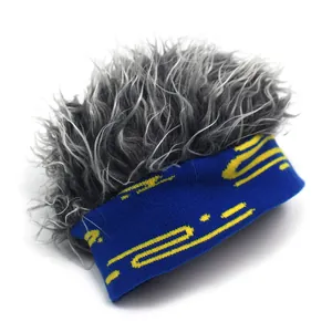 Blue knit beanie featuring a fuzzy silver-grey wig and abstract yellow geometric patterns