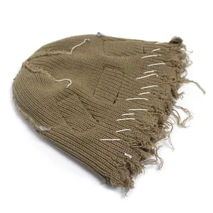 Distressed tan knit balaclava with eye holes and white hand-stitched detailing for men