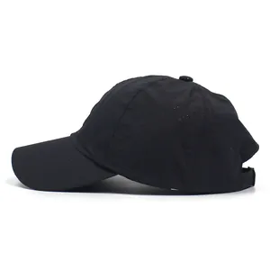 Side view of black breathable sports cap with laser-cut ventilation holes and curved brim