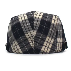 Detail view of the black and white plaid corduroy texture and adjustable back buckle