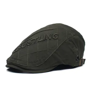 Detail view of cotton flat cap featuring diamond quilting and 3D bustling embroidery