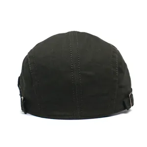 Detail view of cotton flat cap with adjustable metal buckles and stitching on the back