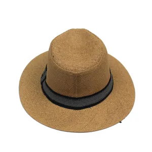 Detailed top view of breathable straw sun hat featuring a black and white grid ribbon band