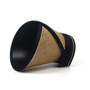 Detail of a foldable brown straw sun visor shown in its rolled-up portable state