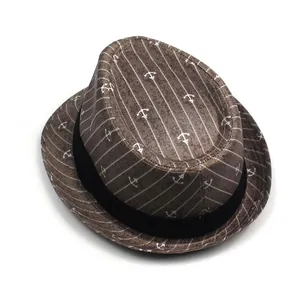 Detail of brown fedora hat with white anchor prints and black decorative band