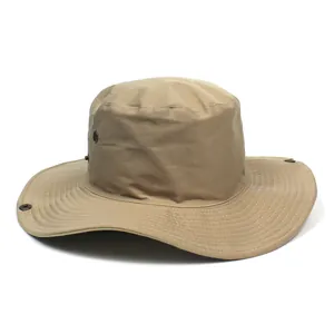 Detail of khaki wide-brim sun hat with reinforced stitching and breathable metal eyelets