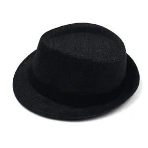Detailed close-up of a black woven trilby hat featuring a matching satin ribbon band