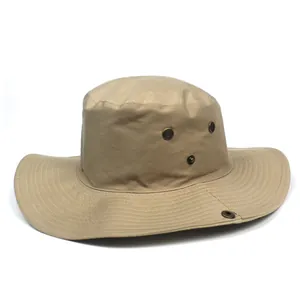 Detail of khaki wide-brim sun hat with bronze ventilation eyelets and side snap buttons