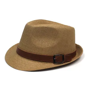 Classic woven straw fedora hat with brown leather belt and metal buckle on white background