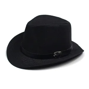 Detail of black straw fedora hat featuring a leather belt strap and silver metal buckle