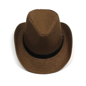 Close-up of brown woven straw sun hat showing texture and black decorative band