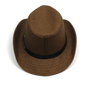 Detail of dark brown woven fedora hat featuring a black band and small metal buckle