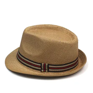 Close-up of small straw fedora featuring red and green striped ribbon and fine weaving