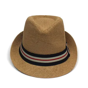 Macro shot of fedora straw hat weave texture with red and blue striped grosgrain ribbon