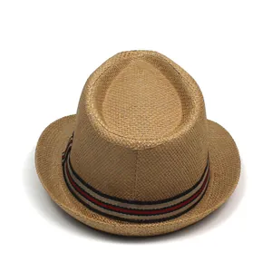 Detailed close-up of woven straw fedora featuring a red black and white striped ribbon band
