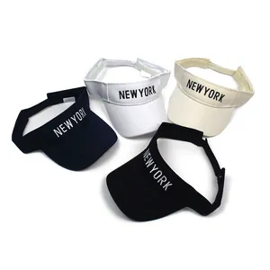 Detail view of NEW YORK embroidered sun visors in navy, white, beige, and black